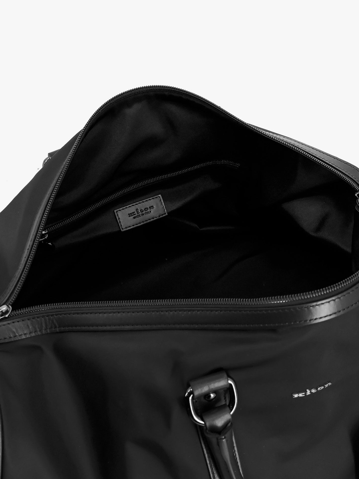 Nylon duffel bag with leather inserts