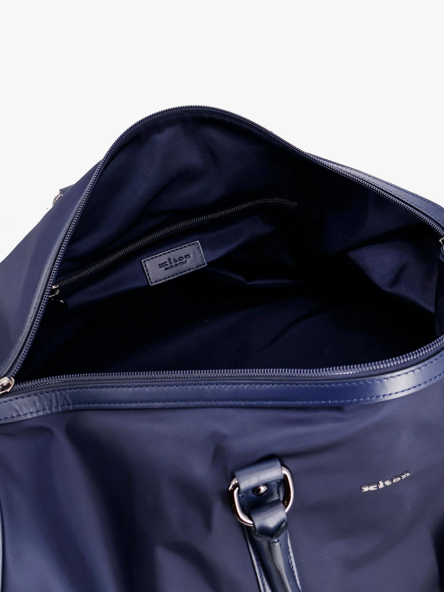 Nylon duffel bag with leather inserts