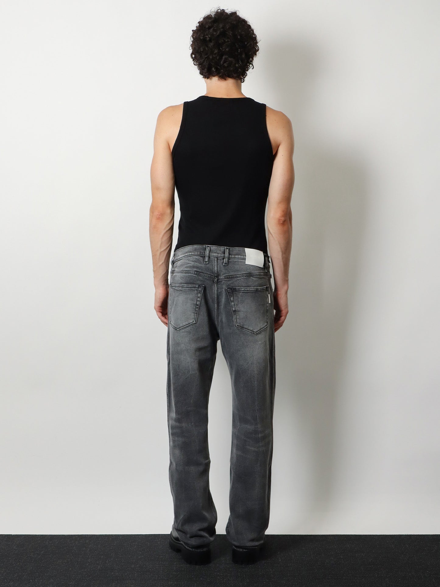 Denim trousers with back logo patch