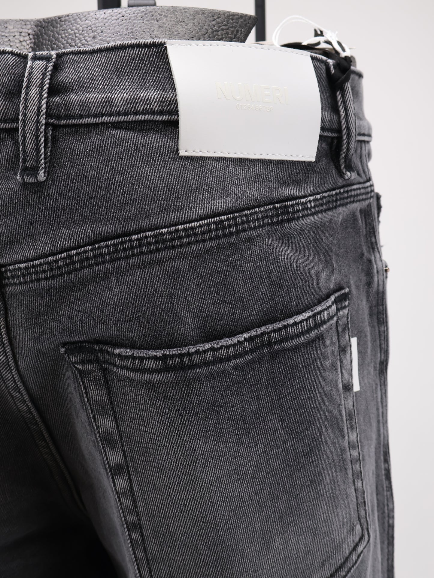 Denim trousers with back logo patch