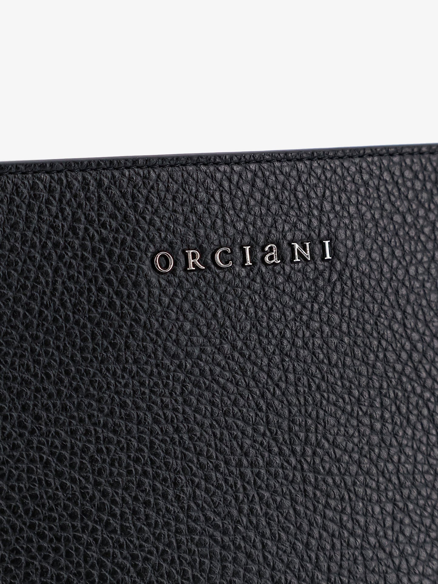 Hammered leather clutch with logo on the front