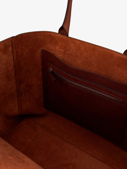 Hammered leather handbag with engraved logo on the front thumbnail