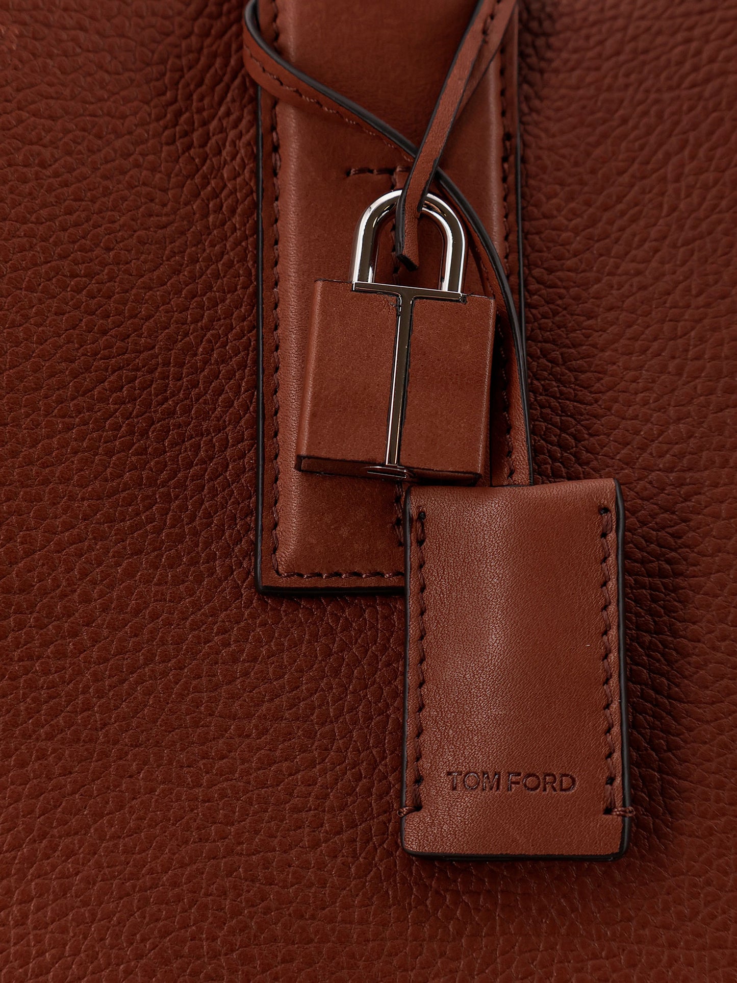 Hammered leather handbag with engraved logo on the front