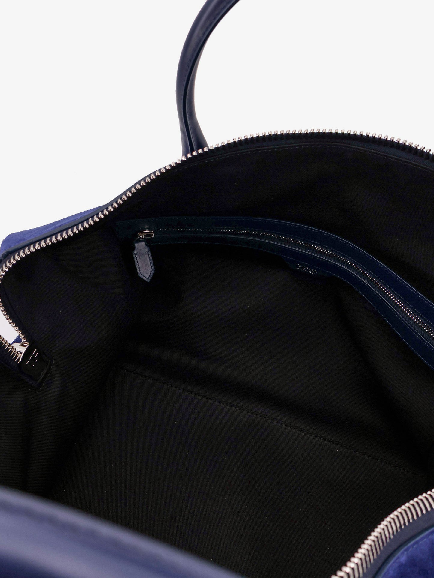 Suede travel bag with engraved logo on the front