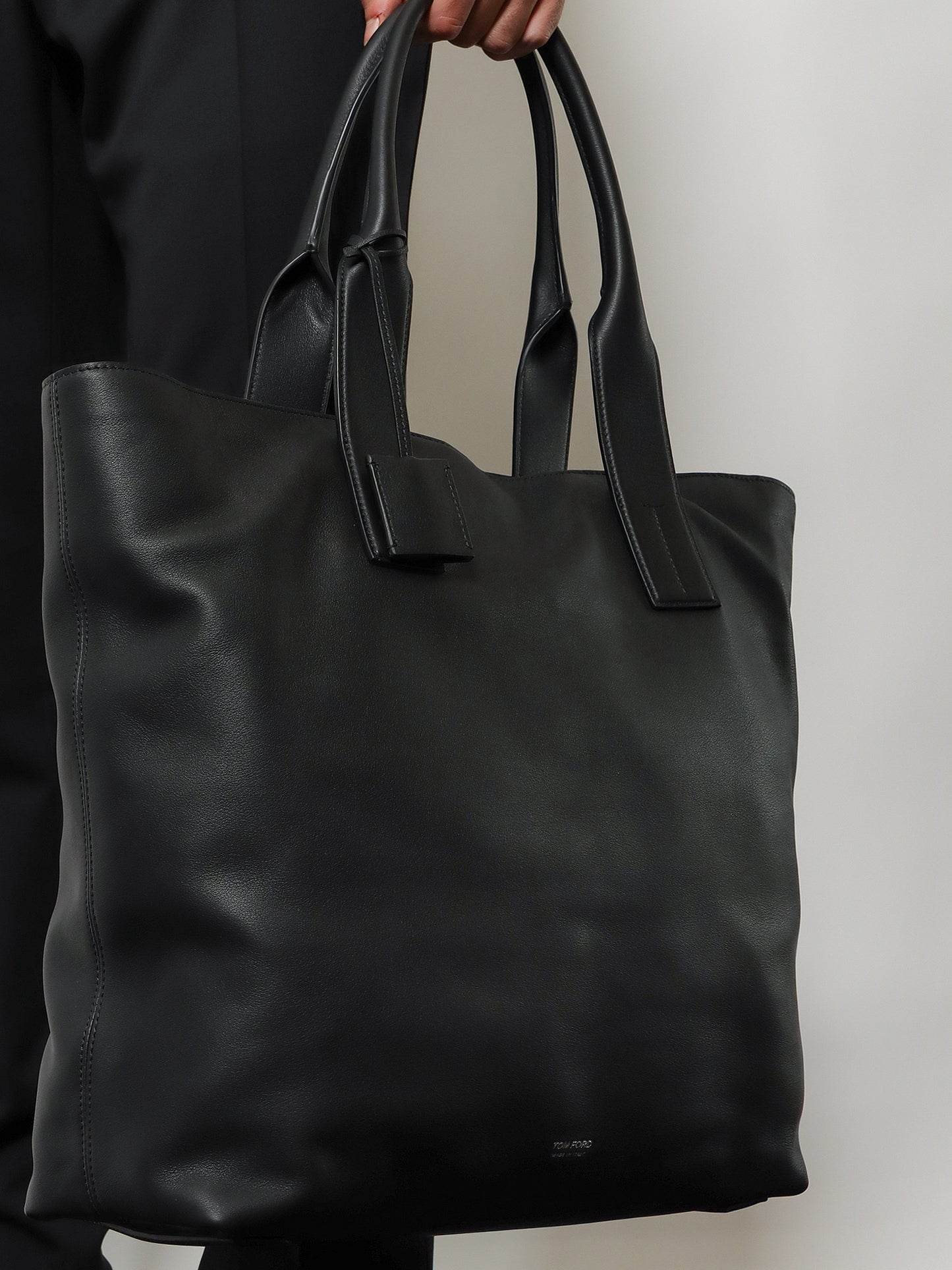 Leather shopping bag with logo lettering on the bottom