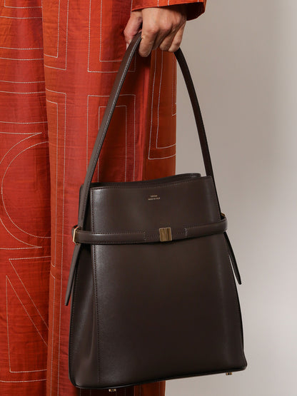 Leather bucket bag with strap on the front thumbnail