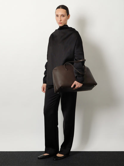 Suede handbag with engraved logo on the front thumbnail