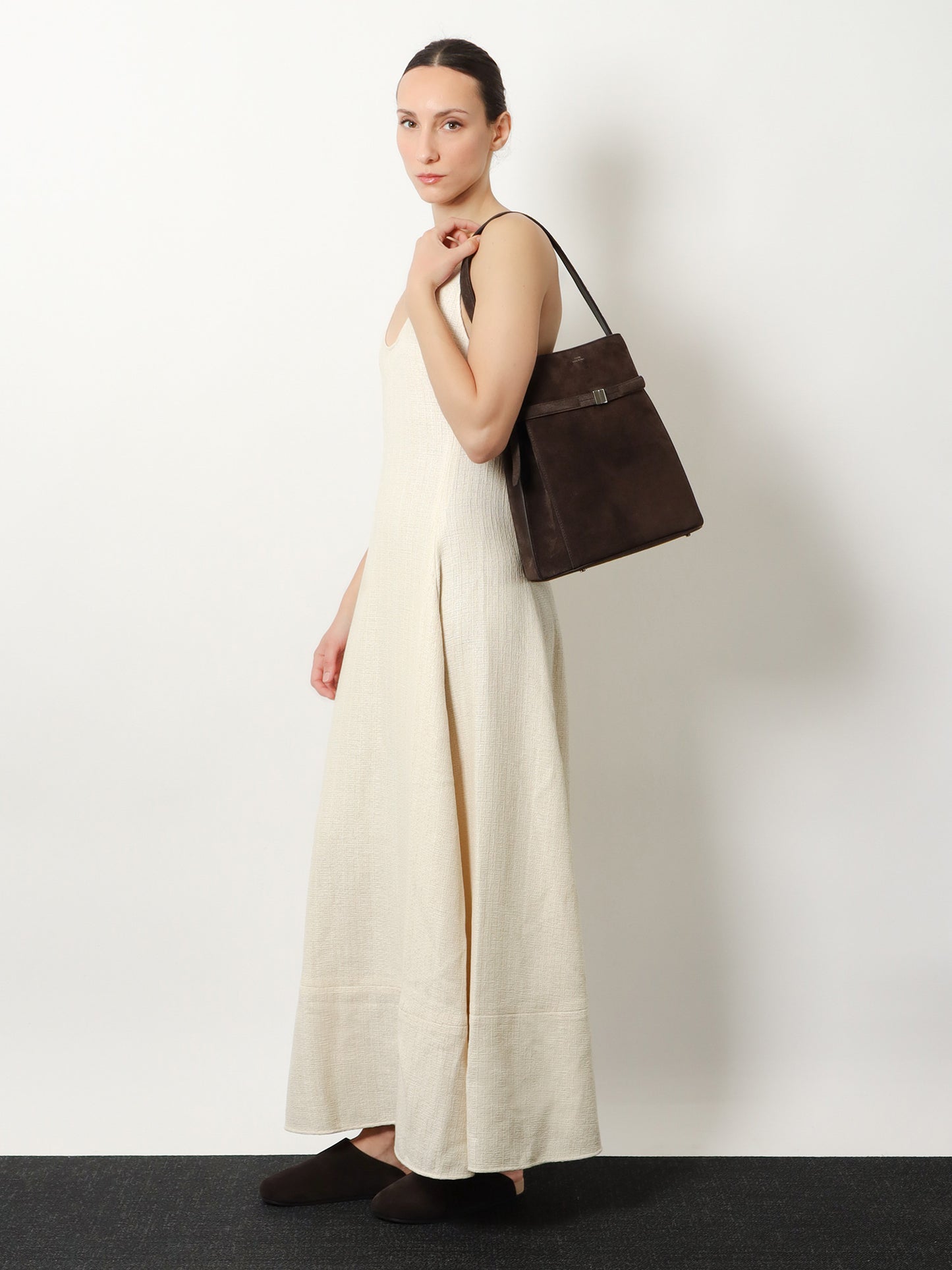 Belted suede bucket bag
