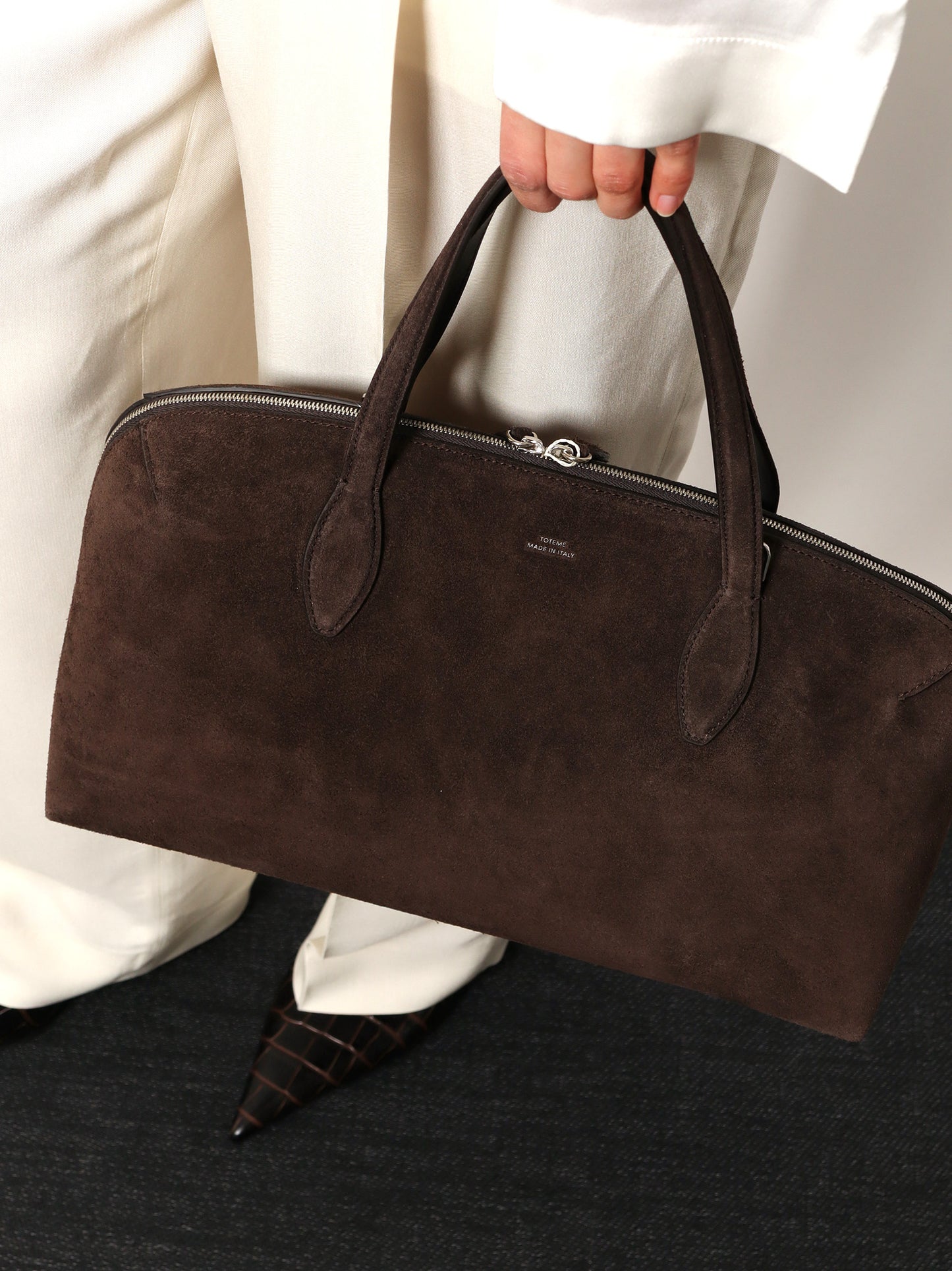 Suede shoulder bag with logo lettering on the front