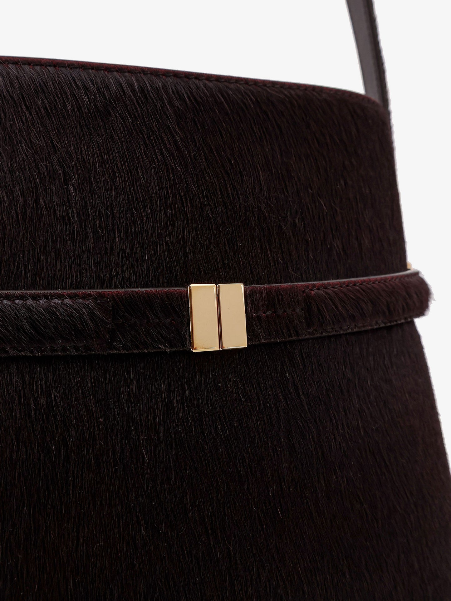 Pony skin shoulder bag with strap on the front