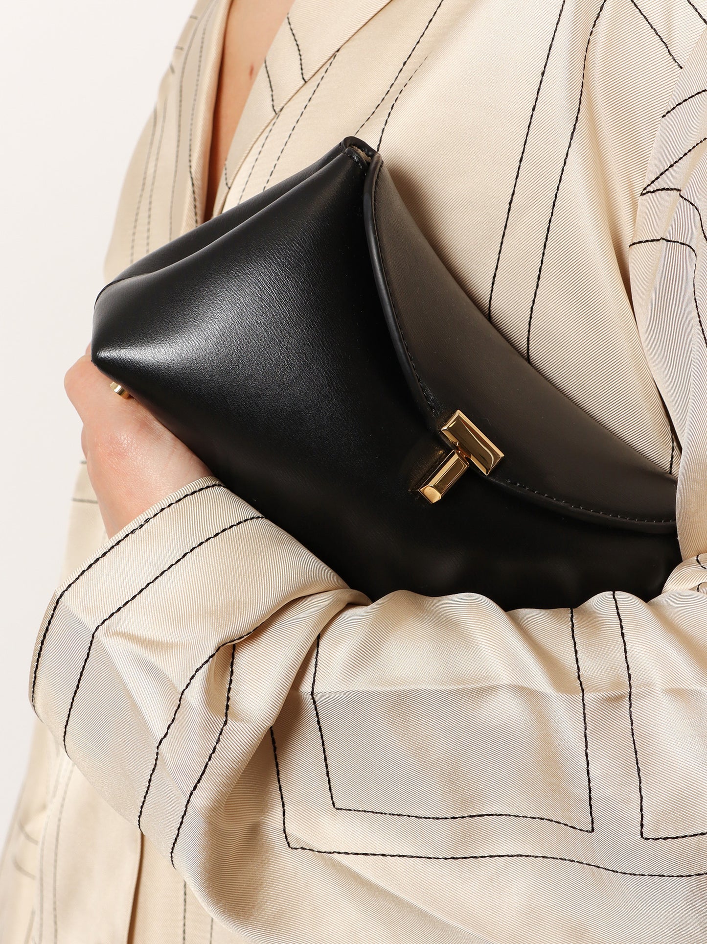 Mini T-Lock leather clutch