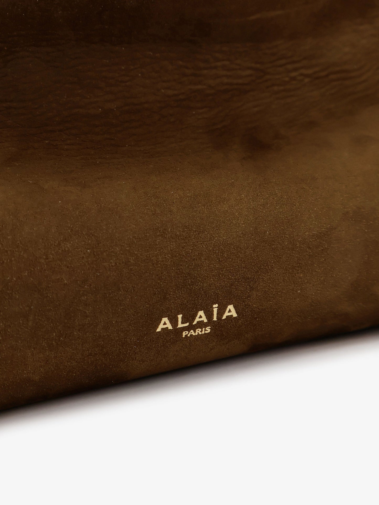 East West leather shoulder bag with engraved logo lettering