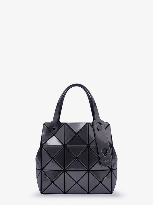 Carat handbag with geometric inserts