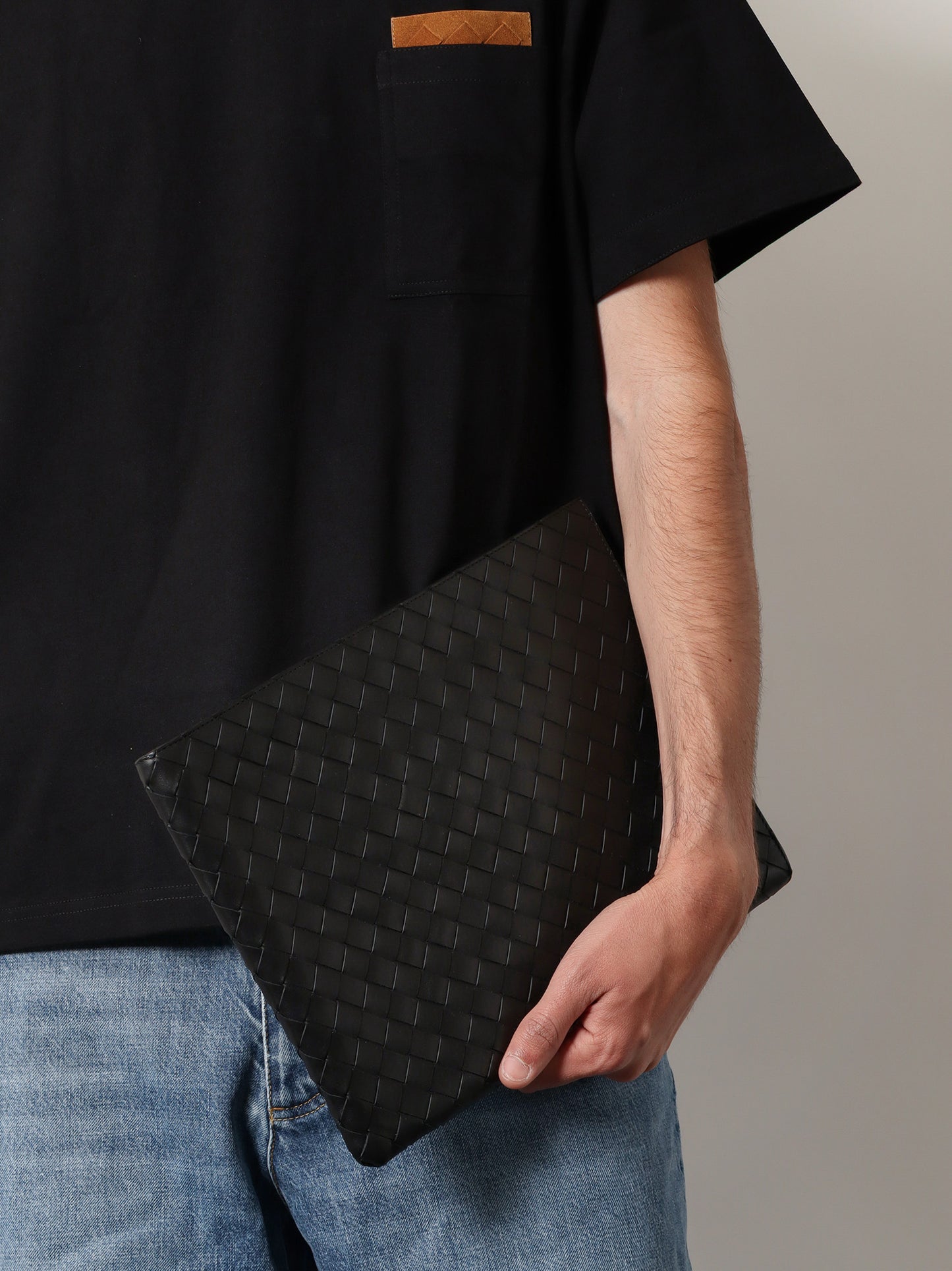 Woven leather pochette