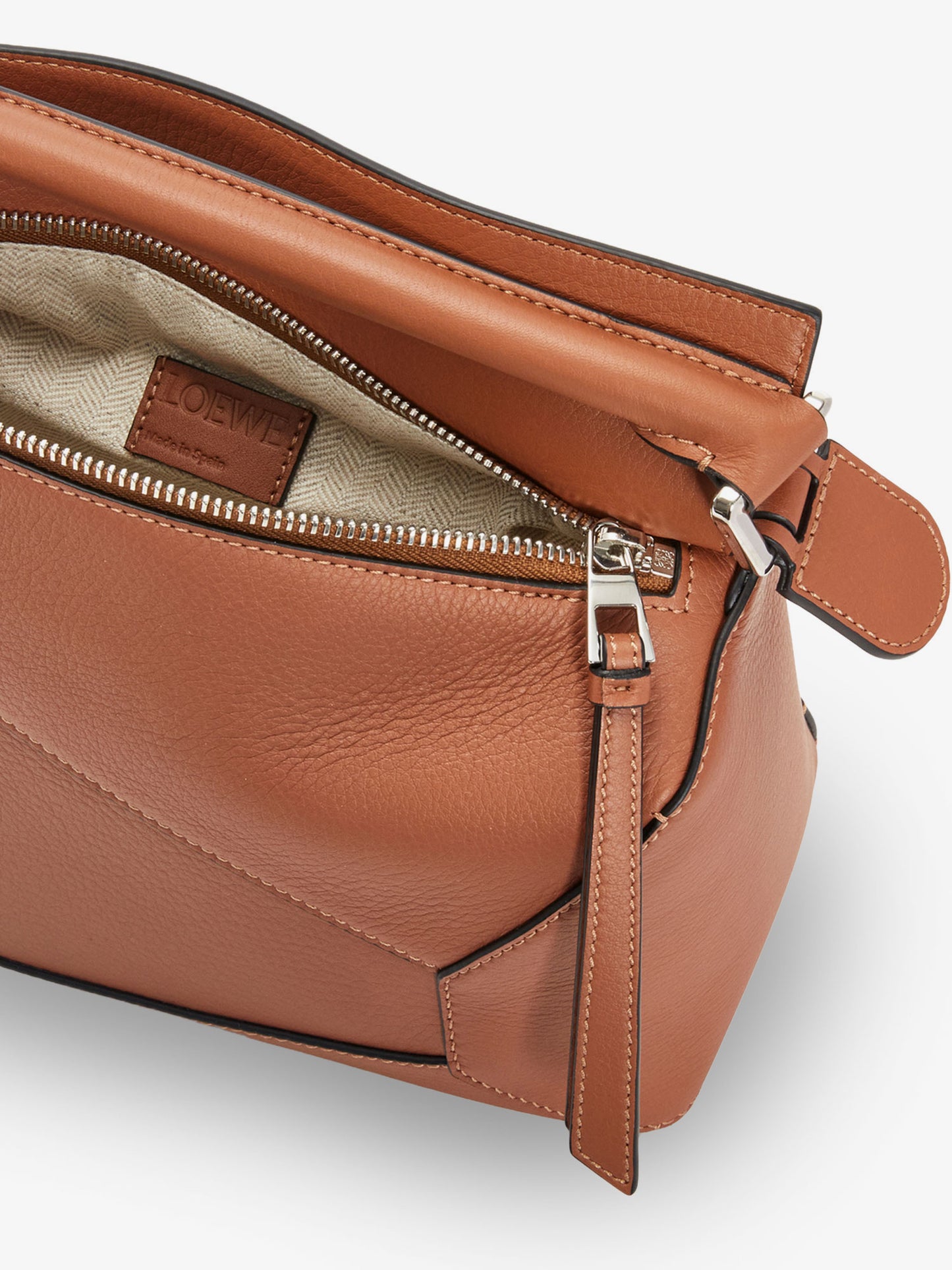 Puzzle Edge leather handbag with engraved Anagram logo