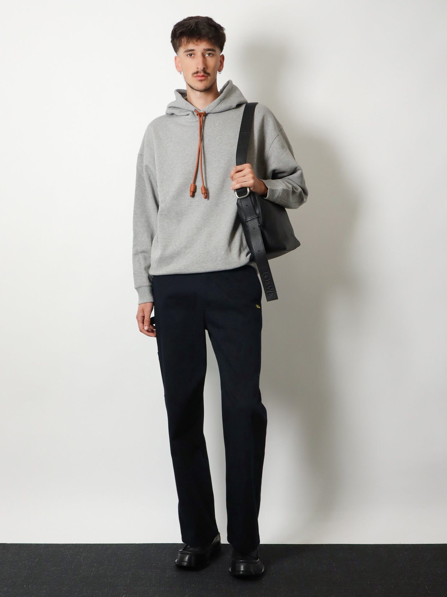 Denim trousers with contrasting embroidered logo
