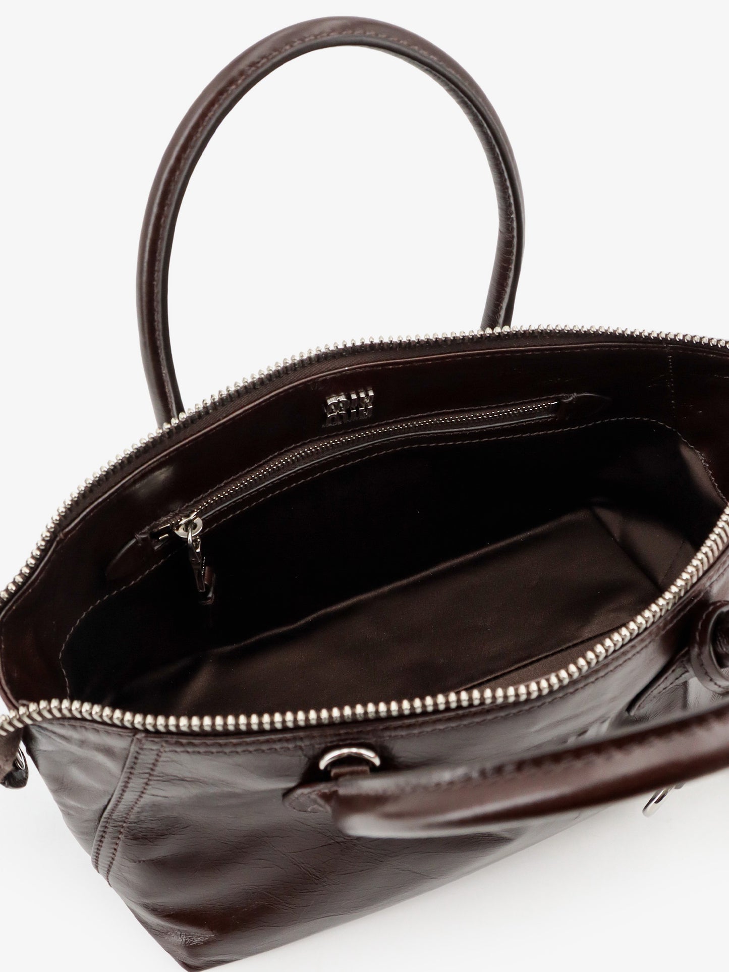 Leather handbag with embossed lettering logo