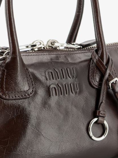 Leather handbag with embossed lettering logo thumbnail