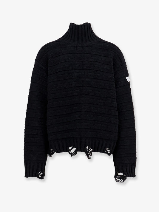 Wool blend sweater with distressed effect