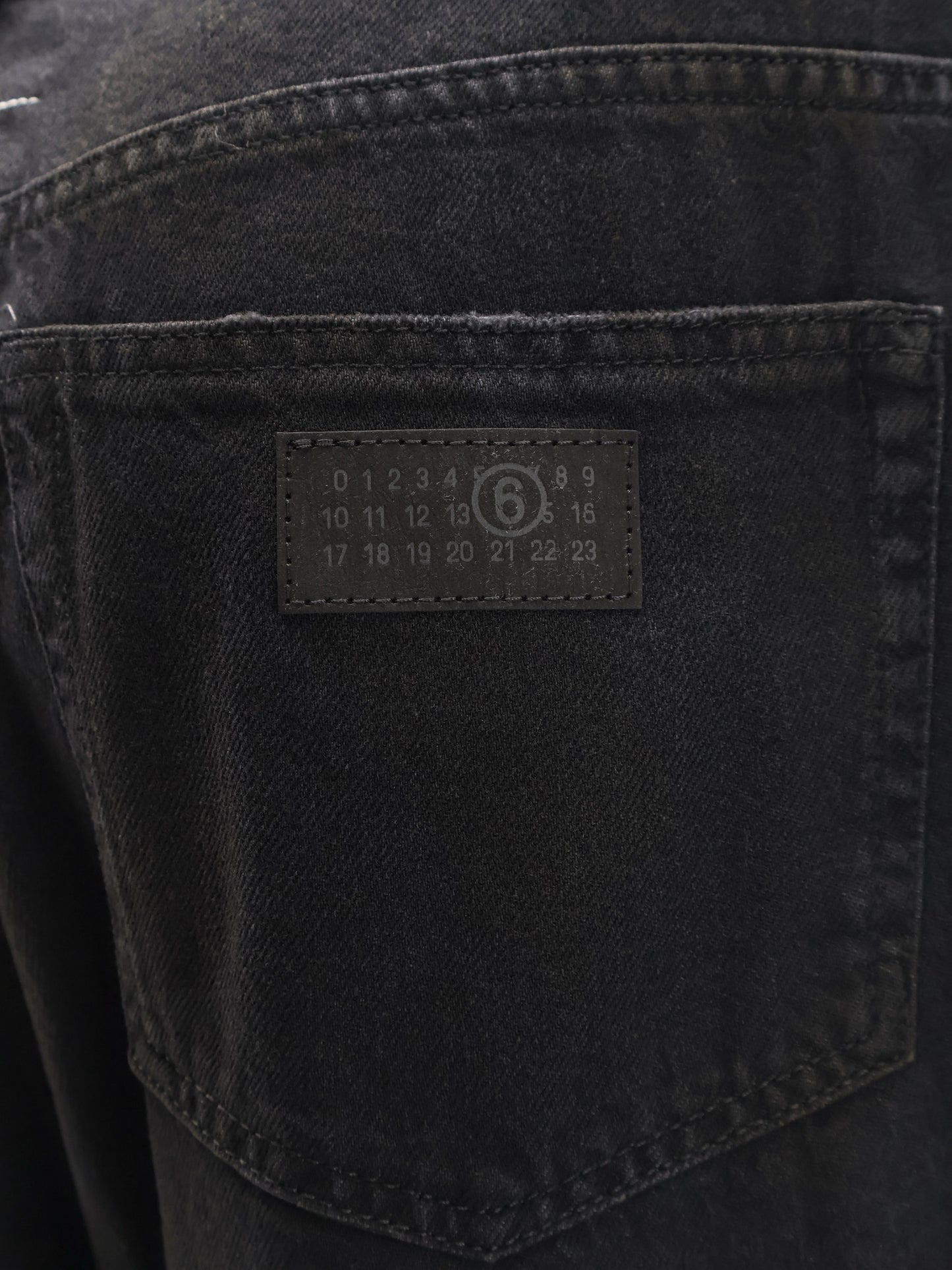 Black denim trousers
