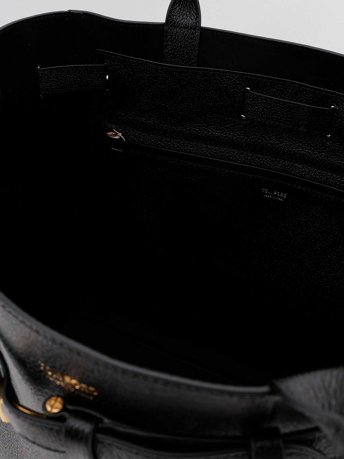 Leather shoulder bag with engraved logo on the front