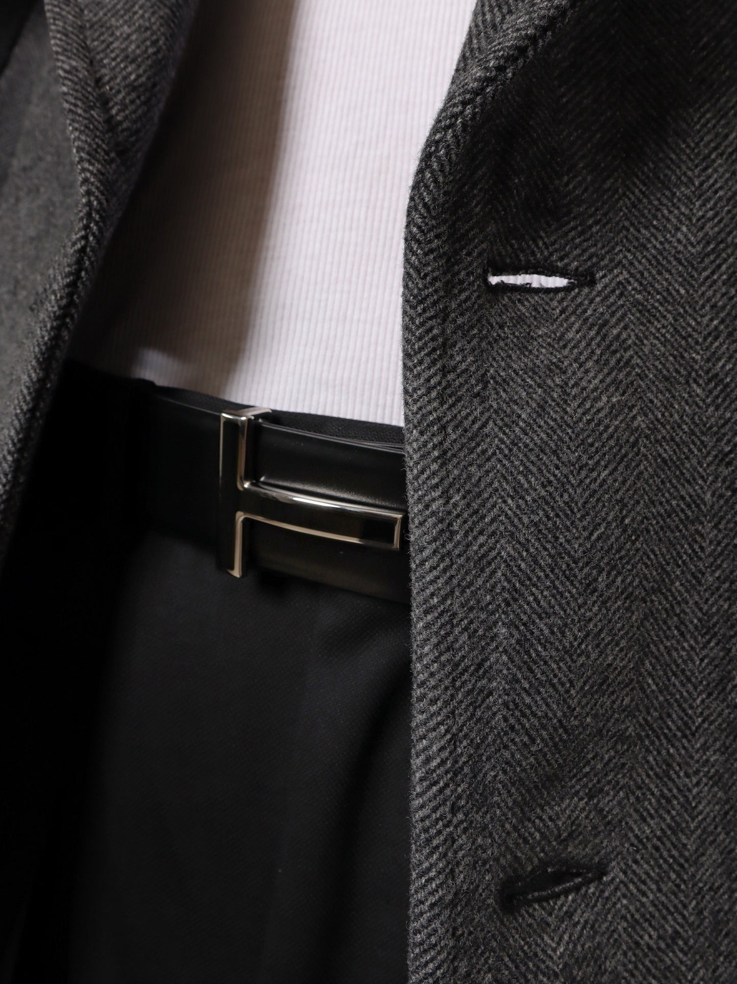 Leather belt with enameled logo
