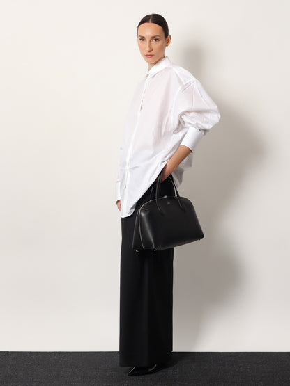 Leather handbag with engraved logo on the front thumbnail