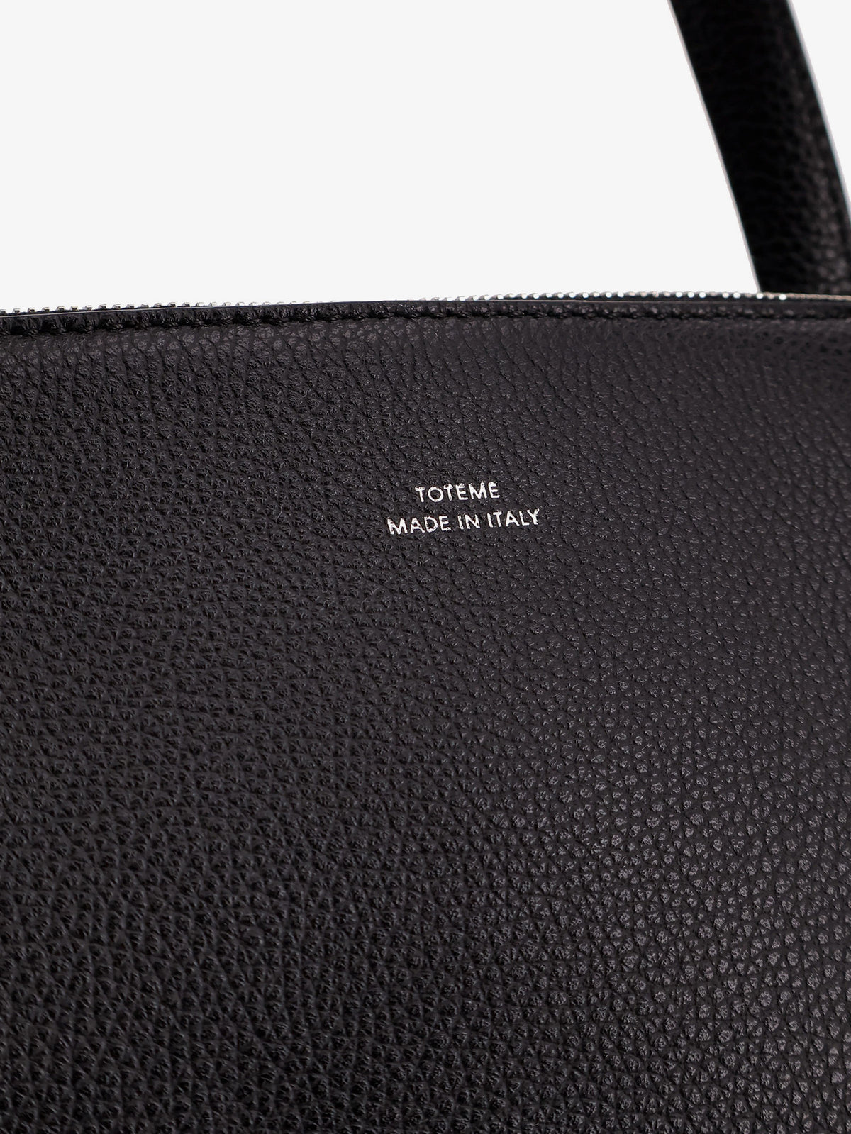 Leather handbag with engraved logo on the front